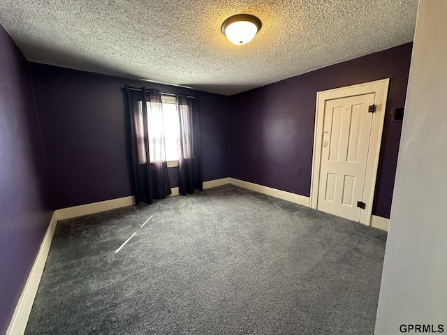 108 S Quince Ave, Dewitt, NE 68341 - empty room featuring a textured ceiling, baseboards, and carpet