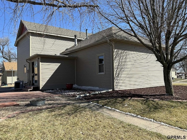 108 S Quince Ave, Dewitt, NE 68341 - view of side of home with central AC unit and entry steps