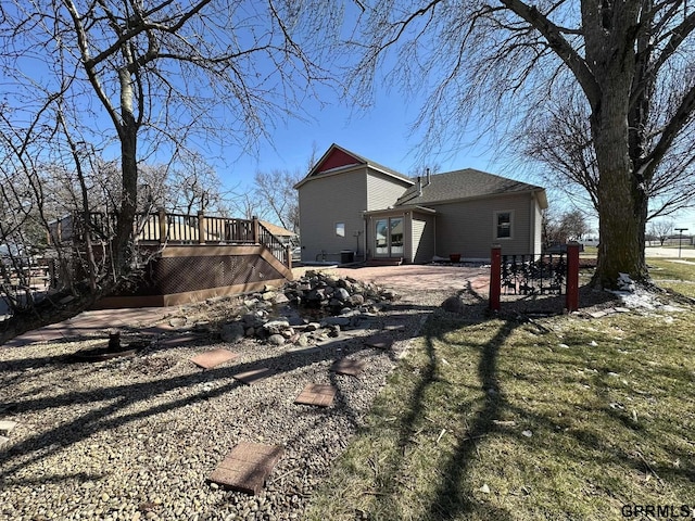 108 S Quince Ave, Dewitt, NE 68341 - back of house with a deck, a lawn, stairway, and a patio