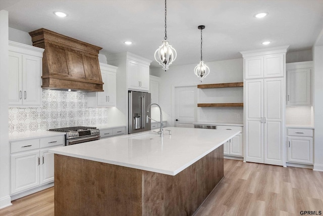 10907 N 167th St, Bennington, NE 68007 - kitchen with appliances with stainless steel finishes, open shelves, a sink, light wood-style floors, and custom range hood
