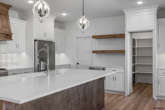 10907 N 167th St, Bennington, NE 68007 - kitchen with high end refrigerator, light wood-type flooring, light countertops, white cabinets, and recessed lighting