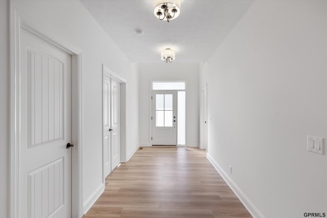 10907 N 167th St, Bennington, NE 68007 - doorway featuring light wood-type flooring and baseboards