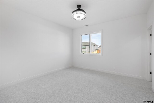 10907 N 167th St, Bennington, NE 68007 - unfurnished room with light carpet and baseboards