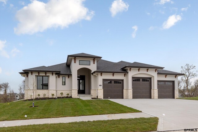 10907 N 167th St, Bennington, NE 68007 - prairie-style house with stone siding, a garage, and stucco siding