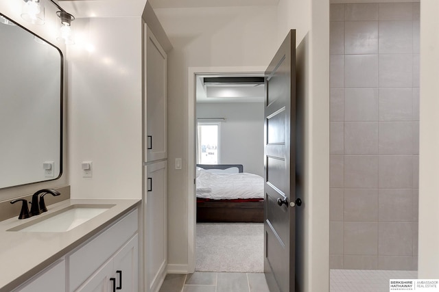 full bathroom with ensuite bath, tiled shower, tile patterned floors, and vanity