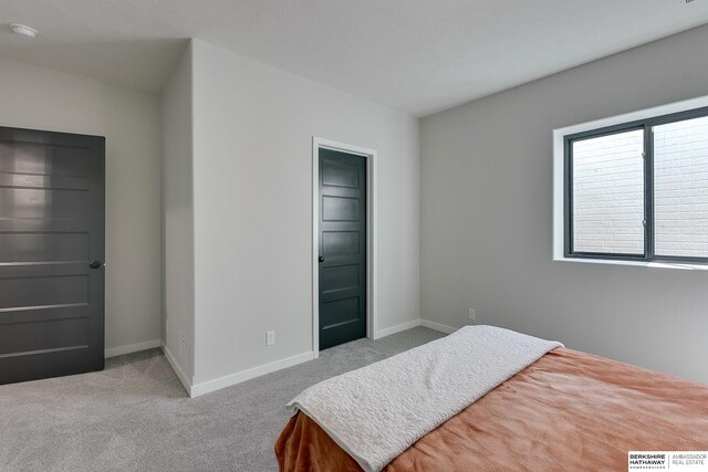 carpeted bedroom with baseboards and visible vents