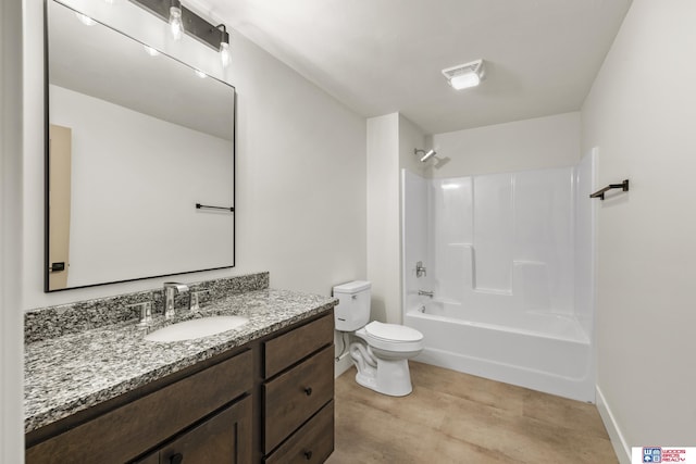 full bath featuring toilet, vanity, washtub / shower combination, baseboards, and visible vents