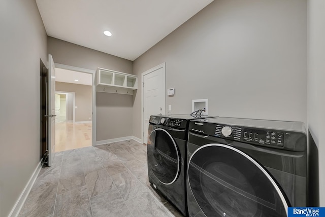 washroom featuring baseboards, washer and dryer, laundry area, and recessed lighting