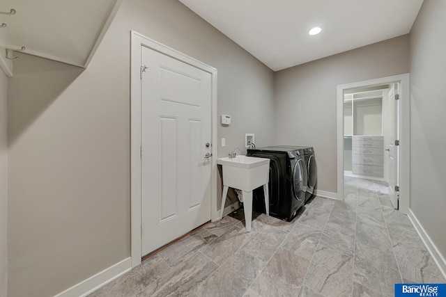 washroom featuring baseboards, washing machine and dryer, laundry area, and recessed lighting
