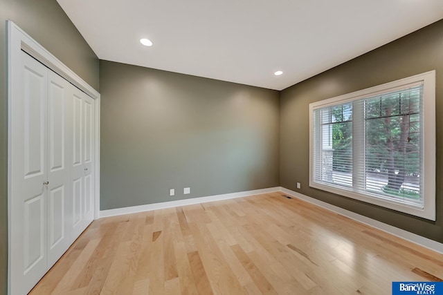 interior space featuring recessed lighting, baseboards, and light wood-type flooring