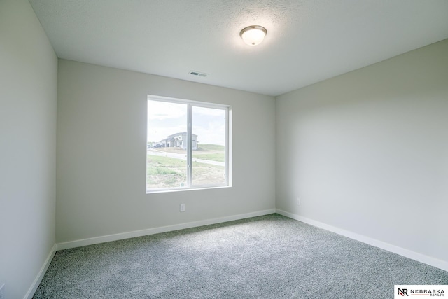 17547 Potter St, Bennington, NE 68007 - carpeted empty room featuring baseboards, visible vents, and a textured ceiling