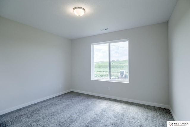 17547 Potter St, Bennington, NE 68007 - spare room with baseboards, visible vents, and carpet