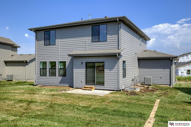 17547 Potter St, Bennington, NE 68007 - back of property featuring central air condition unit and a yard