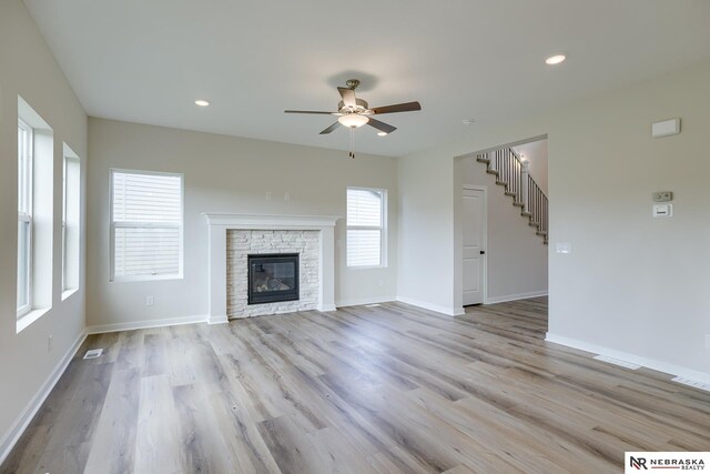 17547 Potter St, Bennington, NE 68007 - unfurnished living room featuring baseboards, stairway, ceiling fan, and light wood-style floors