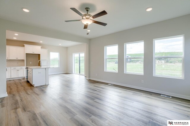 17547 Potter St, Bennington, NE 68007 - unfurnished living room with recessed lighting, baseboards, light wood finished floors, visible vents, and a ceiling fan