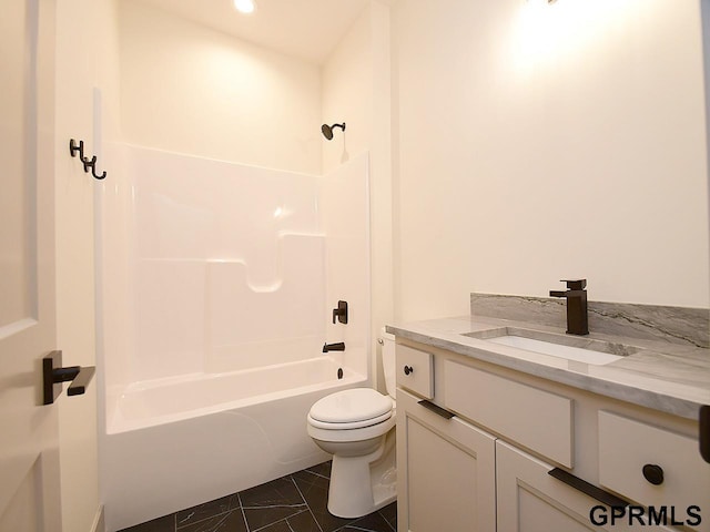 bathroom with toilet, vanity, and bathing tub / shower combination