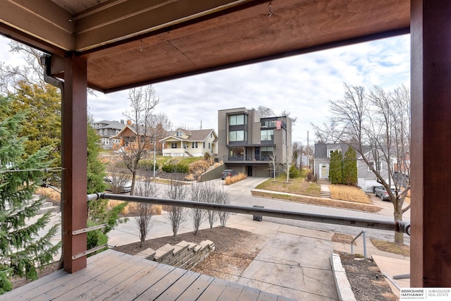 wooden deck featuring a residential view