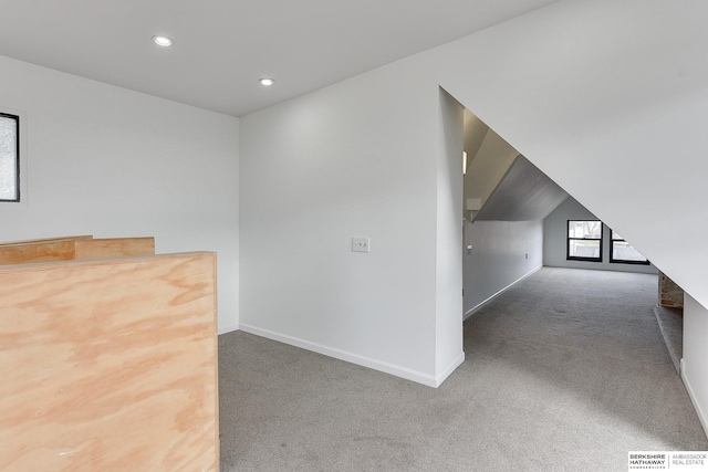 bonus room featuring baseboards, carpet floors, vaulted ceiling, and recessed lighting