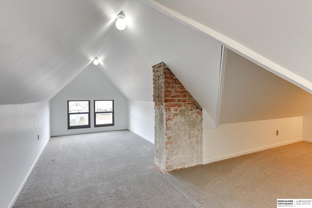 bonus room featuring baseboards, vaulted ceiling, visible vents, and carpet