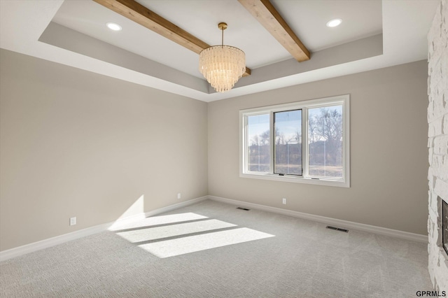 carpeted empty room with baseboards, visible vents, a chandelier, and beam ceiling