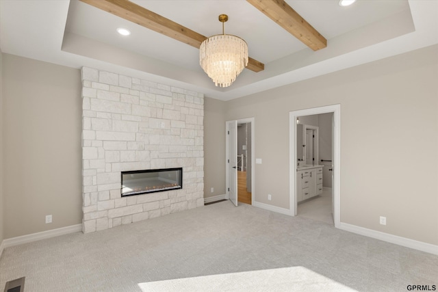 unfurnished living room with baseboards, carpet flooring, visible vents, and a chandelier