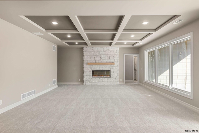 unfurnished living room with baseboards, visible vents, coffered ceiling, and carpet