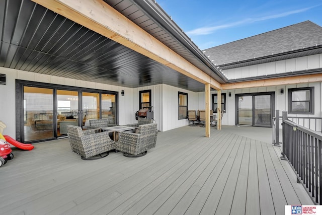 deck with outdoor dining area