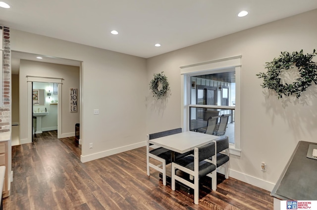 dining room with dark wood-style floors, baseboards, and recessed lighting