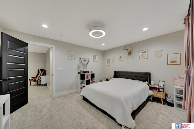 bedroom with visible vents, light carpet, baseboards, and recessed lighting