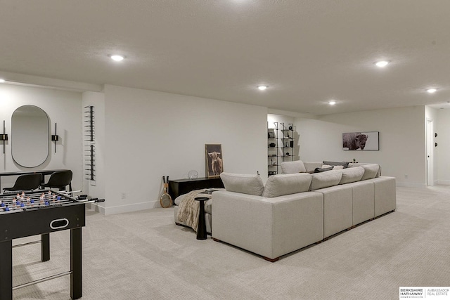 living area with baseboards, recessed lighting, and light colored carpet