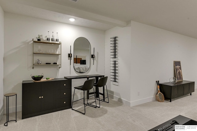bar with baseboards and light colored carpet