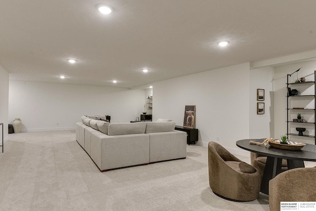 living room with light carpet, baseboards, and recessed lighting