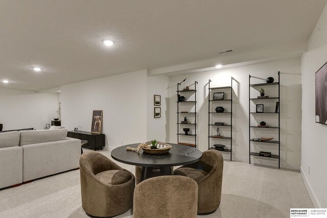 dining room with visible vents, recessed lighting, and light colored carpet