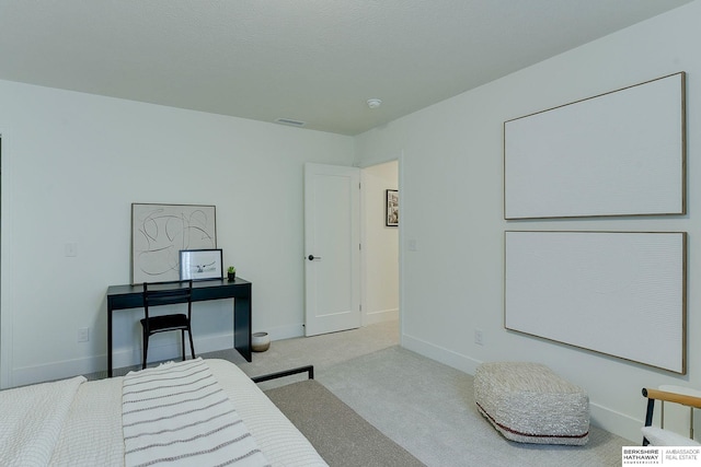 bedroom with baseboards, carpet floors, and visible vents