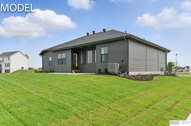20720 Kansas Ave, Elkhorn, NE 68022 - rear view of property featuring central air condition unit, a lawn, and a patio