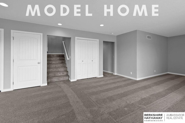 interior space featuring recessed lighting, baseboards, stairs, and visible vents