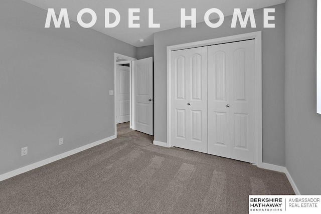 unfurnished bedroom with baseboards, a closet, and carpet