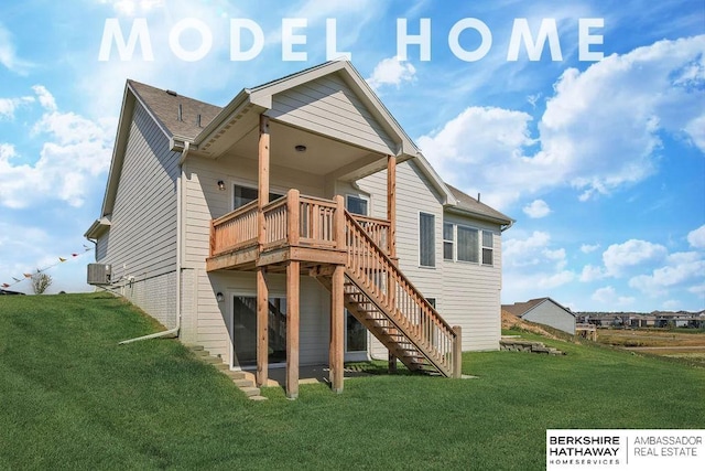 back of house featuring a deck, stairway, and a yard