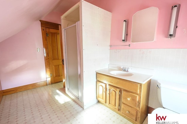 bathroom with lofted ceiling, tile patterned floors, toilet, and a shower stall