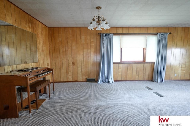 dining area with carpet flooring, a chandelier, and visible vents