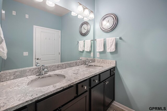 16604 Weber St, Bennington, NE 68007 - full bath featuring double vanity, baseboards, and a sink