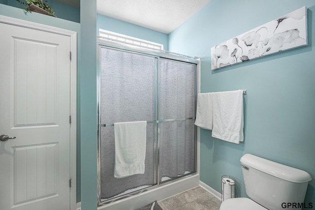 16604 Weber St, Bennington, NE 68007 - bathroom with baseboards, toilet, and a shower stall