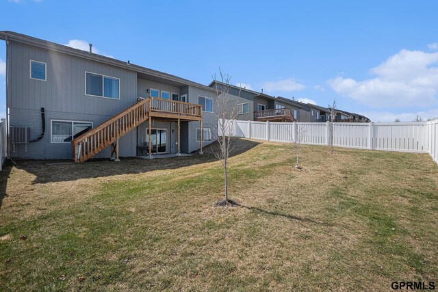 16604 Weber St, Bennington, NE 68007 - back of house with a fenced backyard, a deck, stairway, and a yard