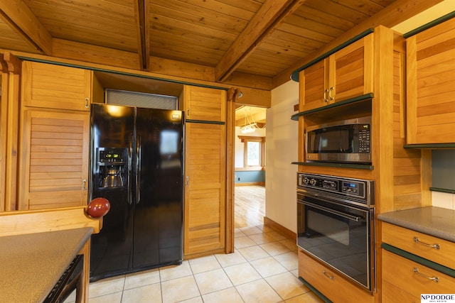 kitchen featuring beam ceiling, light tile patterned flooring, dark countertops, wooden ceiling, and black appliances