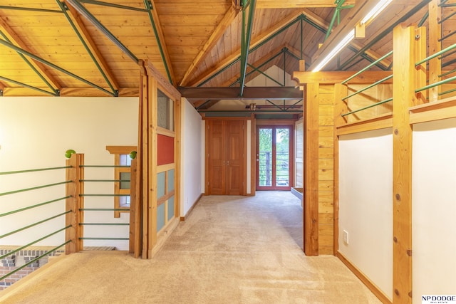 hall with vaulted ceiling with beams, carpet, and wood ceiling