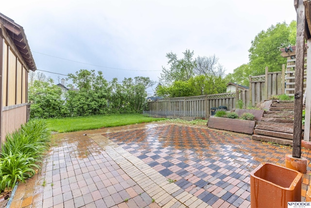view of patio / terrace featuring fence