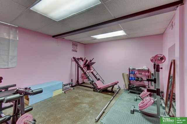 workout room with a paneled ceiling
