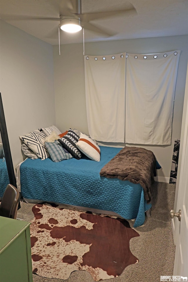 carpeted bedroom featuring a ceiling fan