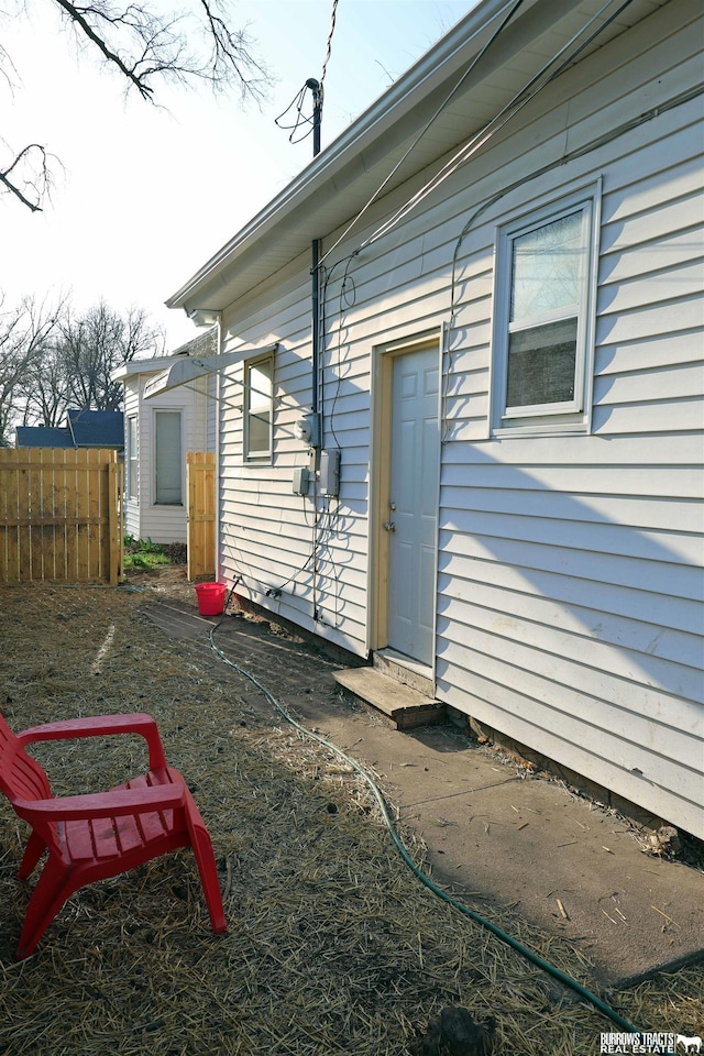 rear view of property with fence