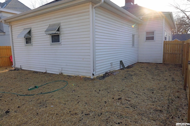 view of home's exterior with fence private yard